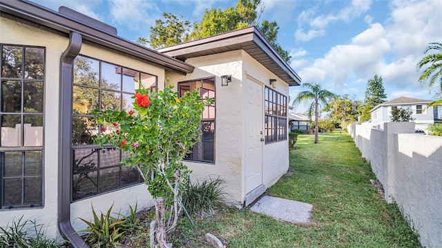 view of home's exterior with a yard