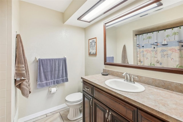 bathroom featuring tile patterned flooring, vanity, toilet, and curtained shower