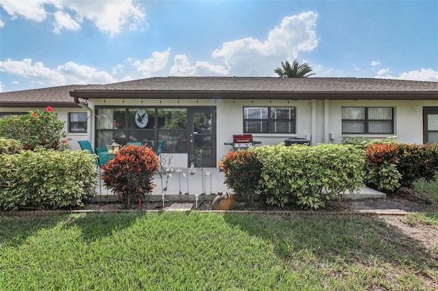 ranch-style house with a front lawn