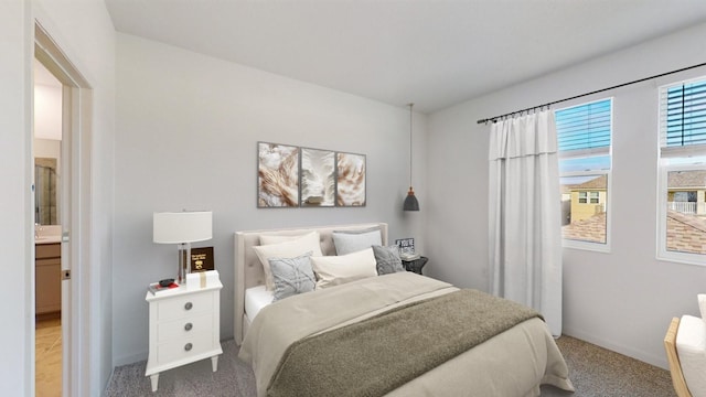 bedroom featuring carpet and ensuite bath