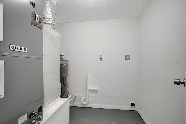 washroom with electric water heater, heating unit, and electric dryer hookup