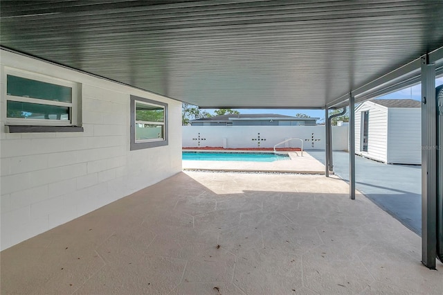 view of swimming pool with a patio area