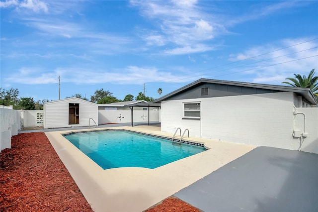 view of swimming pool with a storage unit and a patio