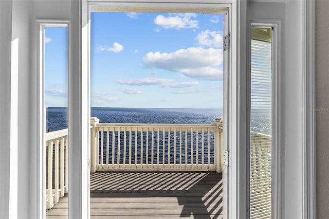 balcony featuring a water view