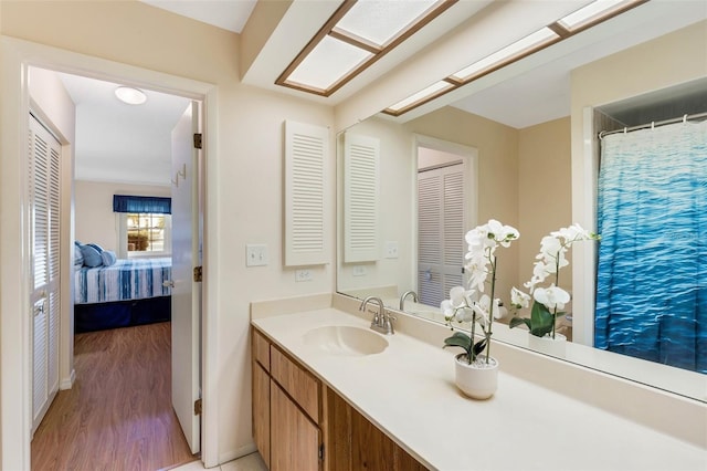 bathroom featuring vanity and hardwood / wood-style flooring