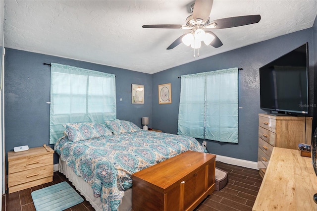 bedroom featuring a textured ceiling and ceiling fan