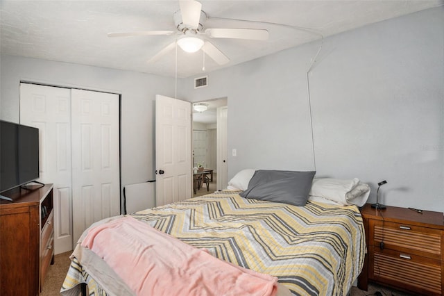 bedroom featuring a closet, ceiling fan, and carpet floors