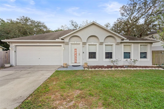 ranch-style house with a front yard and a garage