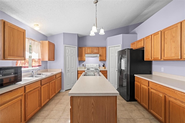 kitchen featuring pendant lighting, black appliances, sink, a textured ceiling, and a kitchen island