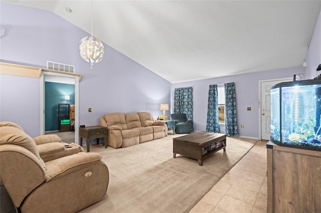 tiled living room with a notable chandelier, lofted ceiling, and a textured ceiling