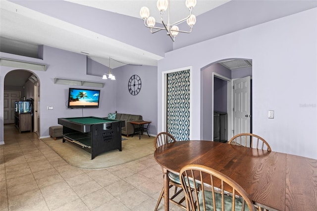 dining space with lofted ceiling, pool table, and a chandelier