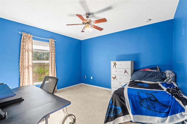 bedroom with a textured ceiling, light colored carpet, and ceiling fan