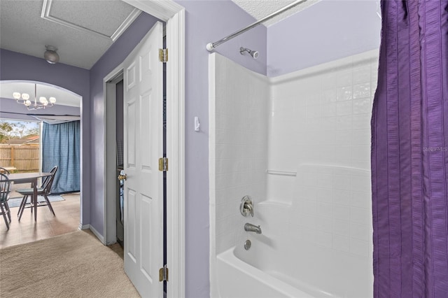 2102 Deltona Blvd, Spring Hill, FL 34606 - bathroom featuring shower / tub combo, baseboards, a textured ceiling, and a chandelier