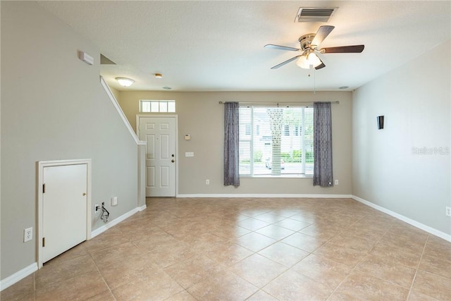 interior space with ceiling fan