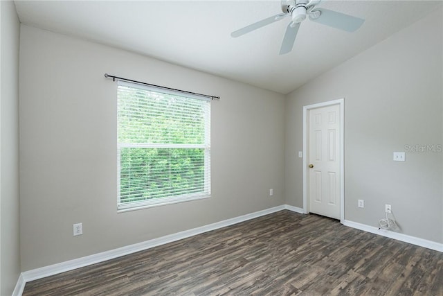 empty room featuring dark hardwood / wood-style floors, plenty of natural light, lofted ceiling, and ceiling fan