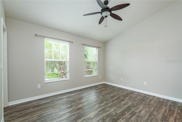 unfurnished room with ceiling fan, dark hardwood / wood-style flooring, and vaulted ceiling