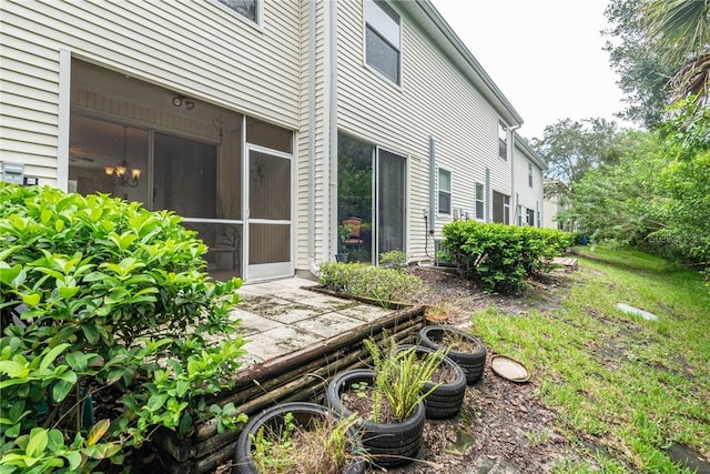 view of yard featuring a sunroom