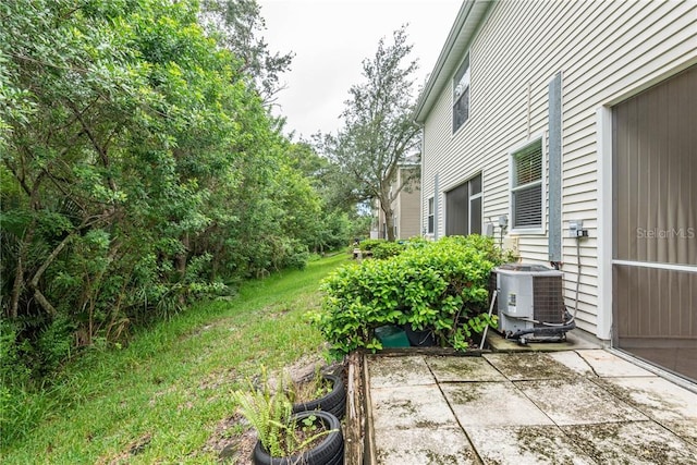 view of yard with a patio area and central AC unit