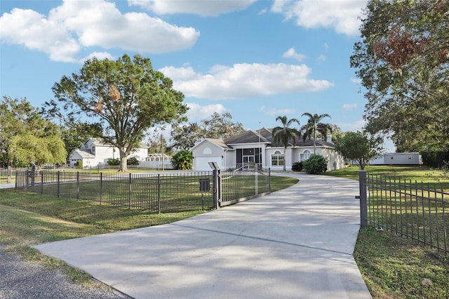 single story home with a front yard and a garage