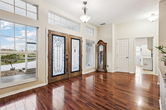 entryway featuring french doors and dark wood-type flooring