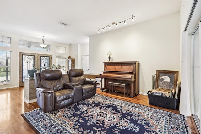 living room with french doors and wood-type flooring