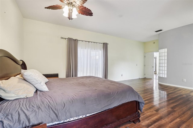 bedroom with dark hardwood / wood-style floors and ceiling fan