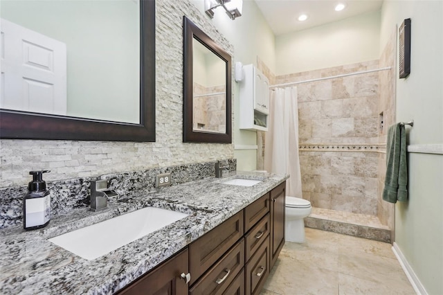 bathroom featuring a shower with curtain, vanity, and toilet