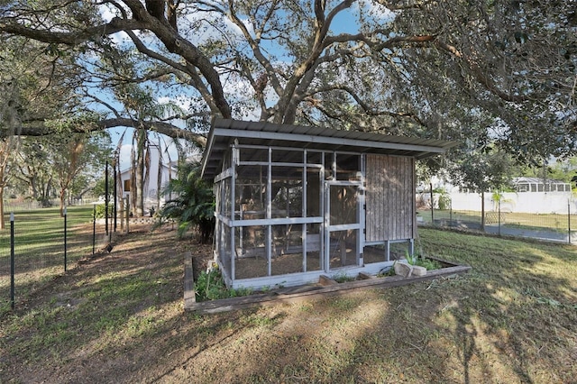 view of outbuilding with a yard