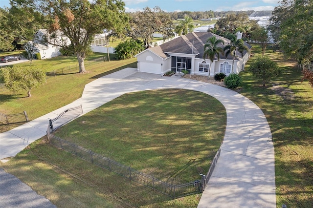 view of front facade with a front yard and a garage