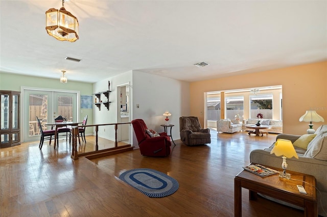 living room featuring hardwood / wood-style floors and french doors