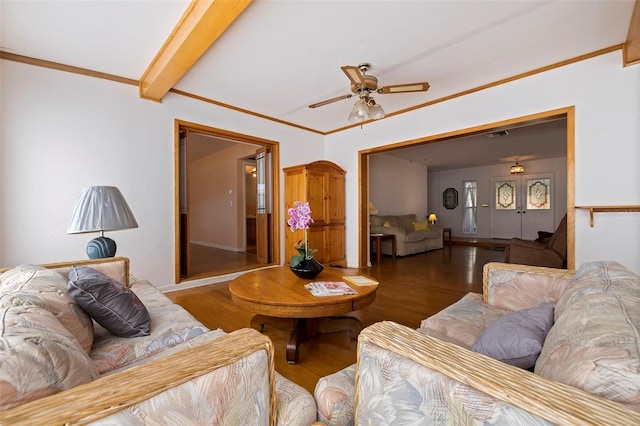 living room featuring ornamental molding, hardwood / wood-style floors, beamed ceiling, and ceiling fan