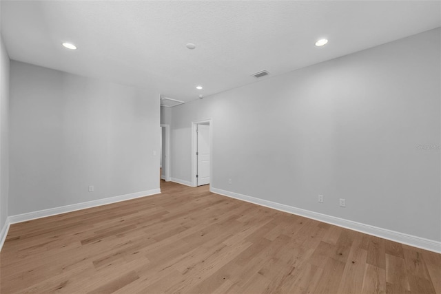 spare room with light wood-type flooring