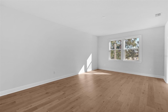 unfurnished room featuring light wood-type flooring