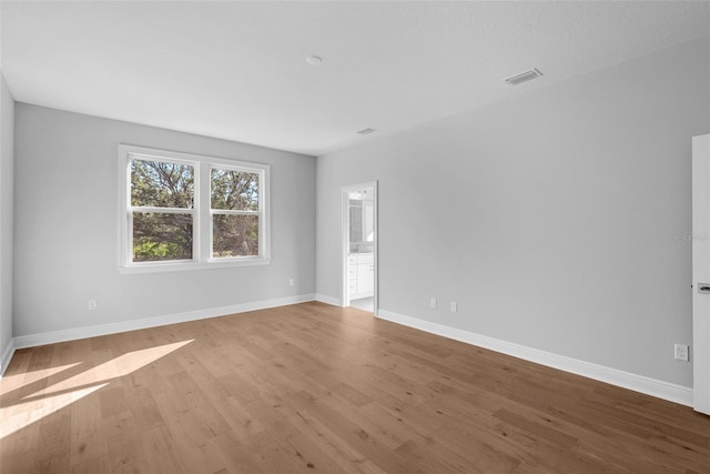 unfurnished room with light hardwood / wood-style flooring