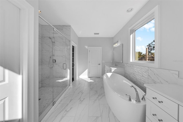 bathroom with vanity and plus walk in shower