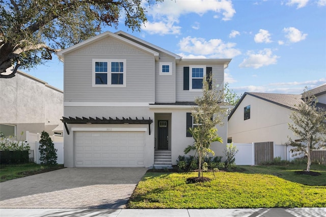 front of property featuring a garage and a front lawn