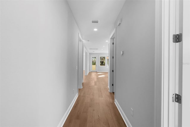 corridor featuring hardwood / wood-style flooring