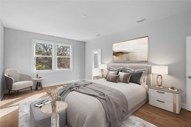 bedroom with light hardwood / wood-style floors