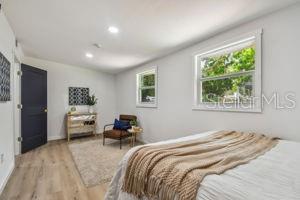 bedroom with light hardwood / wood-style floors