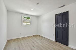 unfurnished room with light hardwood / wood-style floors