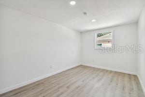 unfurnished room featuring light hardwood / wood-style flooring