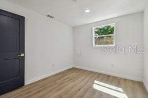 empty room with wood-type flooring