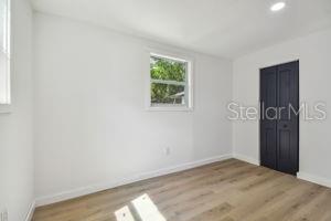 unfurnished bedroom featuring light hardwood / wood-style floors