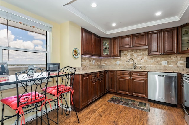 kitchen featuring light stone countertops, dishwasher, sink, tasteful backsplash, and dark hardwood / wood-style flooring