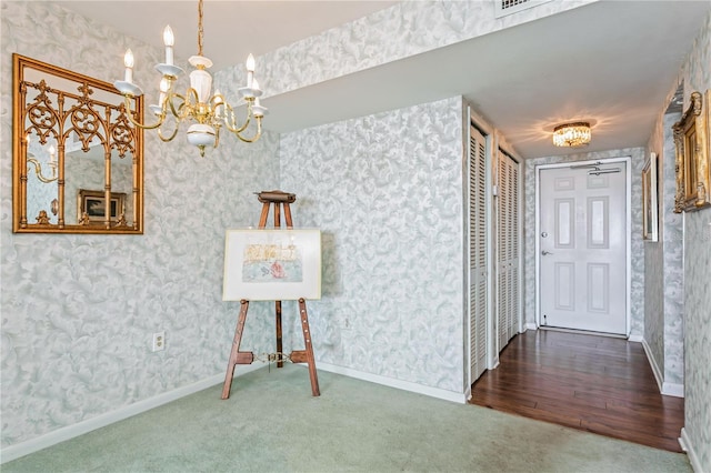 interior space featuring dark hardwood / wood-style flooring and a chandelier