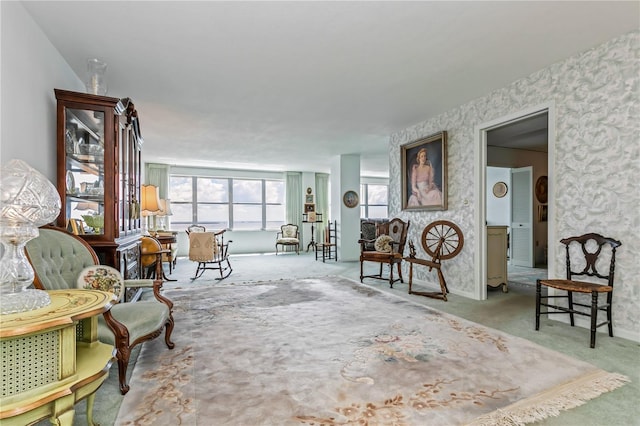 living area featuring light carpet