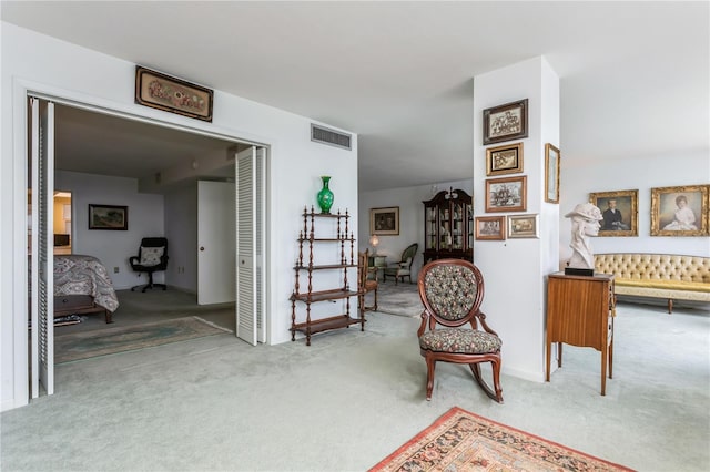 sitting room featuring carpet