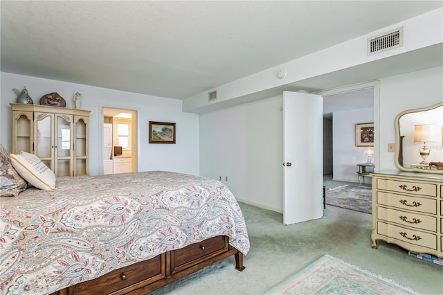 bedroom with light colored carpet