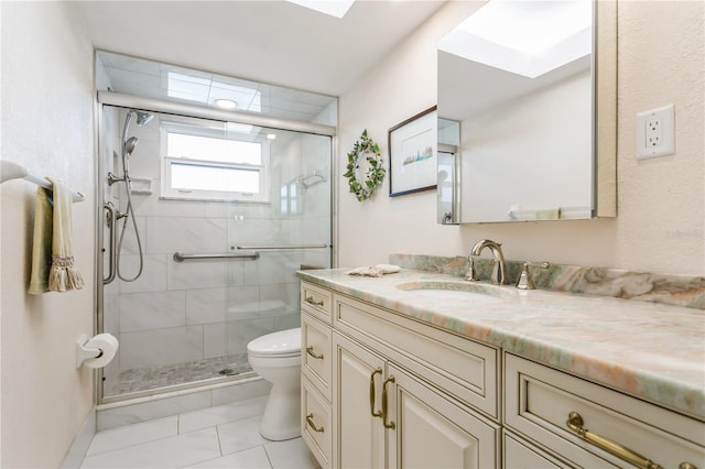 bathroom with a skylight, walk in shower, tile patterned floors, toilet, and vanity