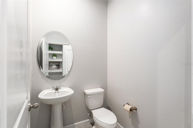 bathroom featuring toilet